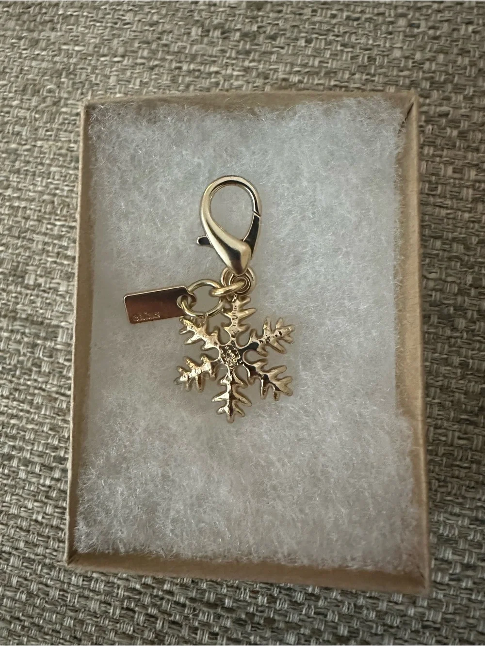 Coach Gold-Tone Snowflake Bag Charm with Logo Branded Tag - Collectible Gift